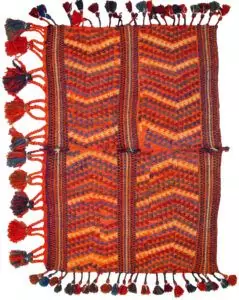 "Antique Qashqai Gahvareh cradle with pompons and tribal patterns" "Handwoven wool baby carrier from South Iran" "Traditional Persian dowry cradle textile" "Vintage tribal baby hammock from Qashqai tribe"
