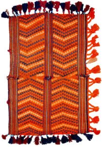 "Antique Qashqai Gahvareh cradle with pompons and tribal patterns" "Handwoven wool baby carrier from South Iran" "Traditional Persian dowry cradle textile" "Vintage tribal baby hammock from Qashqai tribe"