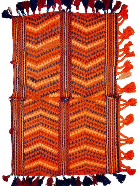 "Antique Qashqai Gahvareh cradle with pompons and tribal patterns" "Handwoven wool baby carrier from South Iran" "Traditional Persian dowry cradle textile" "Vintage tribal baby hammock from Qashqai tribe"
