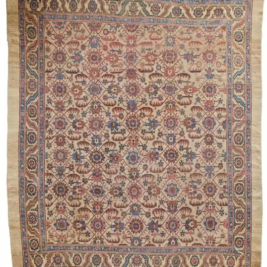 “Antique Bakhshaysh carpet with rare ground colour and floral design” “Vintage Persian rug from Bakhshaysh with yellow and blue borders” “All-over floral lozenge pattern antique carpet” “Decorative Heriz region rug with soft natural colours”
