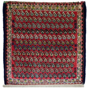 alt="Vintage Qashqai bag face with boteh motifs on red background" alt="Tribal Persian textile with cream floral border and paisley design" alt="Handwoven Qashqai bag face from South Iran" alt="Decorative vintage tribal bag face with boteh motifs"