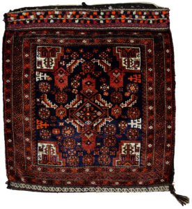alt="Vintage Baluch tribal bag with dowry tufts and goat motifs" alt="Handwoven Baluch bag with red kilim S-design and flowerheads" alt="Antique Baluch wool bag with tribal symbolism from Northeast Iran" alt="Collectible Persian tribal bag with rich colours and unique details"