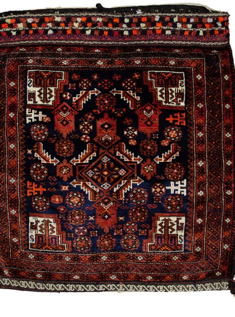 alt="Vintage Baluch tribal bag with dowry tufts and goat motifs" alt="Handwoven Baluch bag with red kilim S-design and flowerheads" alt="Antique Baluch wool bag with tribal symbolism from Northeast Iran" alt="Collectible Persian tribal bag with rich colours and unique details"