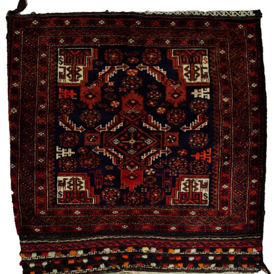 alt="Vintage Baluch tribal bag with dowry tufts and goat motifs" alt="Handwoven Baluch bag with red kilim S-design and flowerheads" alt="Antique Baluch wool bag with tribal symbolism from Northeast Iran" alt="Collectible Persian tribal bag with rich colours and unique details"