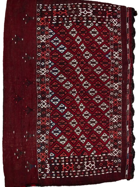 13390-Turkman-75x105cm.jpg alt="Vintage Turkman Tobreh bag with deep maroon field and lozenge design" alt="Turkman tribal bag with lozenges and stylised bushes from Northeast Iran" alt="Decorative Persian Tobreh bag with rich red wool and traditional motifs" alt="Handwoven Turkman wool bag in maroon with natural dyes"