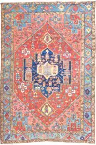 alt="Unusual Heriz or Karaja carpet with terracotta ground and blue, peach, yellow accents" alt="Characterful Persian rug with unique medallion and harmonious colour palette" alt="Restored antique Heriz Karaja rug with geometric motifs and warm tones" alt="Decorative Heriz rug with rare spandrel design and terracotta base"