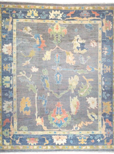 alt="Ushak rug with grey-blue field and bold floral motifs" alt="Handwoven Turkish Ushak rug with antique finish and petrol blue border" alt="Ushak rug with natural dyes and handspun wool in floral all-over design" alt="Grey blue Ushak carpet with vintage look for modern or classic interiors"
