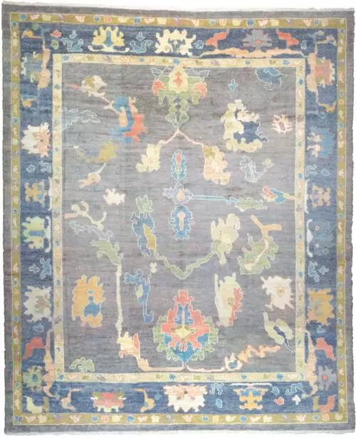 alt="Ushak rug with grey-blue field and bold floral motifs" alt="Handwoven Turkish Ushak rug with antique finish and petrol blue border" alt="Ushak rug with natural dyes and handspun wool in floral all-over design" alt="Grey blue Ushak carpet with vintage look for modern or classic interiors"