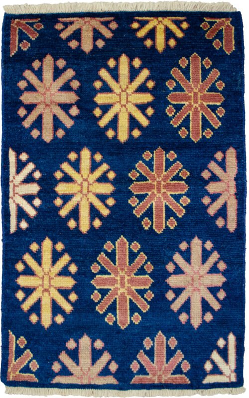 alt="Customisable modern-style Ushak mat with antique finish" alt="Indigo Ushak mat made with handspun wool and natural dyes" alt="Small antique-look rug in modern design, available to order" alt="Handmade Ushak accent mat with soft aged finish"