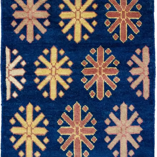 alt="Customisable modern-style Ushak mat with antique finish" alt="Indigo Ushak mat made with handspun wool and natural dyes" alt="Small antique-look rug in modern design, available to order" alt="Handmade Ushak accent mat with soft aged finish"