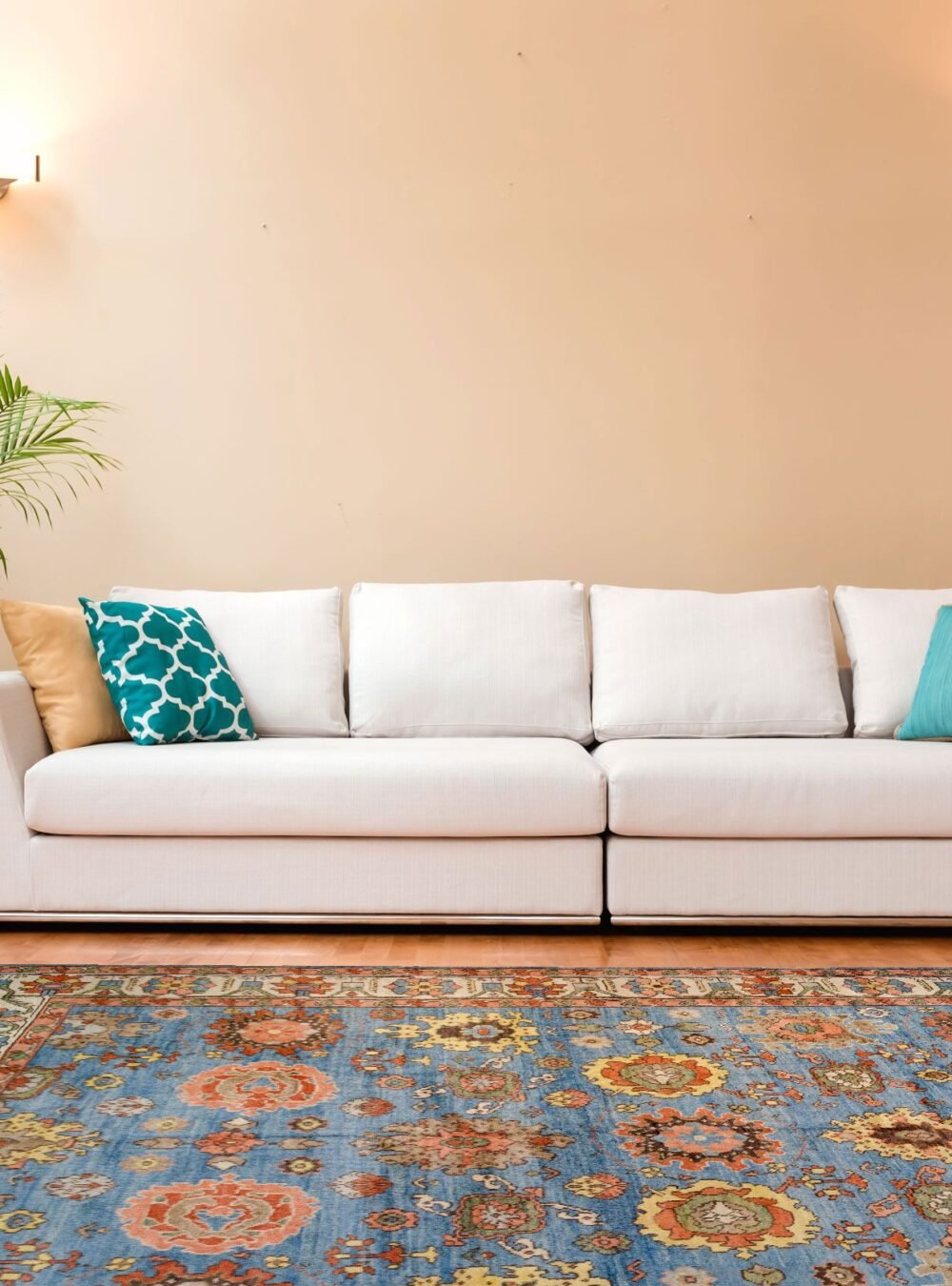 White couch in a large luxury home handmade-wool-rug-living-room.jpg