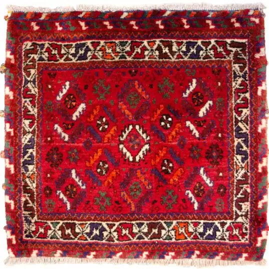 alt="Nomadic bag with deep red field and fish motifs in lozenge pattern" alt="Tribal Persian bag with cream border and shiny wool" alt="Handwoven wool nomadic textile with geometric fish design" alt="Vintage tribal bag from Iran with red and cream colour scheme"