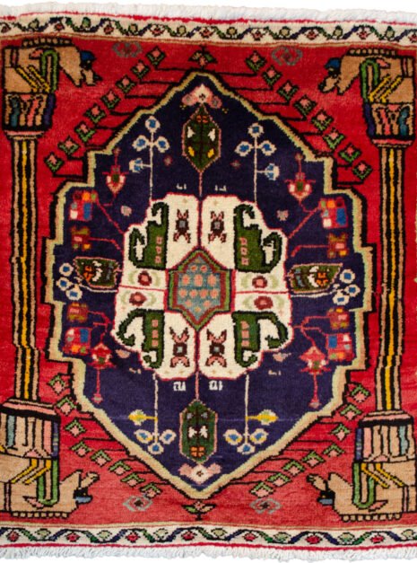 alt="Qashqai rug with Hashtgol medallion and Persepolis pillar design" alt="Persian tribal rug with horse-head pillar motif and paisley medallion" alt="Torki weave Qashqai rug with eight-paisley Hashtgol centre" alt="Hand-knotted Persian rug with classical and tribal motifs"