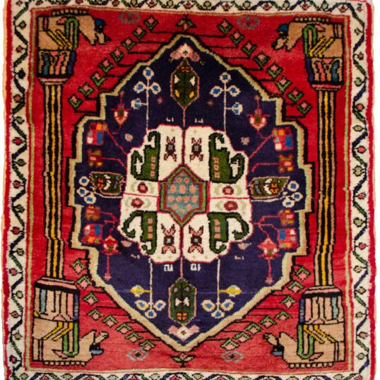alt="Qashqai rug with Hashtgol medallion and Persepolis pillar design" alt="Persian tribal rug with horse-head pillar motif and paisley medallion" alt="Torki weave Qashqai rug with eight-paisley Hashtgol centre" alt="Hand-knotted Persian rug with classical and tribal motifs"