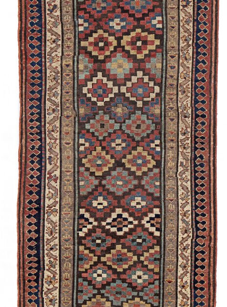 alt="Shahsavan runner from Saveh with tablet motifs on brown ground" alt="Vintage Persian runner with multiple borders and colourful accents" alt="Decorative tribal hallway rug from Saveh region" alt="Long Shahsavan runner with coloured tablets and elegant design"