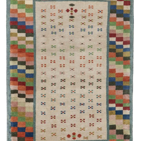 alt="Modern Savonnerie-style rug with multicoloured checked border" alt="Contemporary interpretation of Savonnerie weaving with simple field" alt="Sample Savonnerie rug with bold border and plain interior" alt="Savonnerie weave rug with modern pattern and vibrant edge"