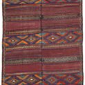alt="Antique Baluch kilim from East Iran with lozenge motifs" alt="Finely woven tribal kilim in two sections sewn together" alt="Vintage Persian kilim with narrow bands and wide multicoloured patterns" alt="Baluch flatweave rug with symbolic lozenges and rich tribal character"