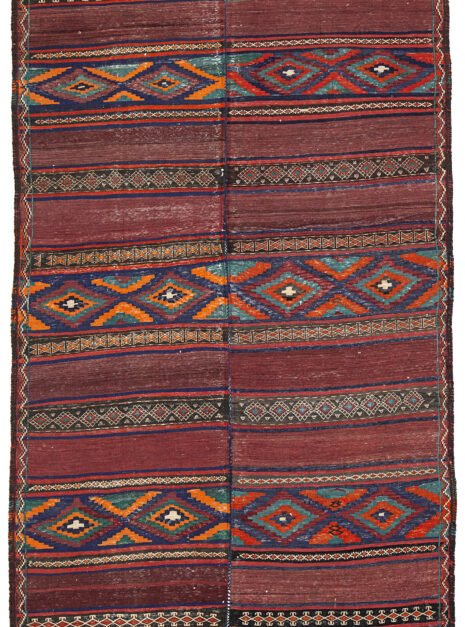 alt="Antique Baluch kilim from East Iran with lozenge motifs" alt="Finely woven tribal kilim in two sections sewn together" alt="Vintage Persian kilim with narrow bands and wide multicoloured patterns" alt="Baluch flatweave rug with symbolic lozenges and rich tribal character"