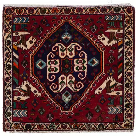 alt="Qashqai tribal mat with paisley and Persepolis pillar motifs" alt="Handwoven Persian mat with horse heads and central tablet design" alt="Small Qashqai rug with symbolic motifs and rich colours" alt="Vintage tribal mat from South Iran with cultural design"
