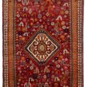 alt="Qashqai rug with red field, cream medallion, and tribal animal motifs" alt="Vintage Persian rug with peacocks, rams, and stylised flowers" alt="Fun Qashqai tribal rug from South Iran with narrow borders" alt="Characterful nomadic rug with symbolic animals and floral elements"