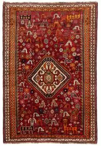 alt="Qashqai rug with red field, cream medallion, and tribal animal motifs" alt="Vintage Persian rug with peacocks, rams, and stylised flowers" alt="Fun Qashqai tribal rug from South Iran with narrow borders" alt="Characterful nomadic rug with symbolic animals and floral elements"