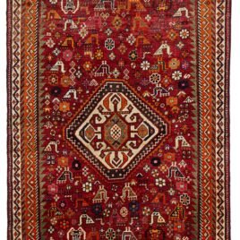 alt="Qashqai rug with red field, cream medallion, and tribal animal motifs" alt="Vintage Persian rug with peacocks, rams, and stylised flowers" alt="Fun Qashqai tribal rug from South Iran with narrow borders" alt="Characterful nomadic rug with symbolic animals and floral elements"