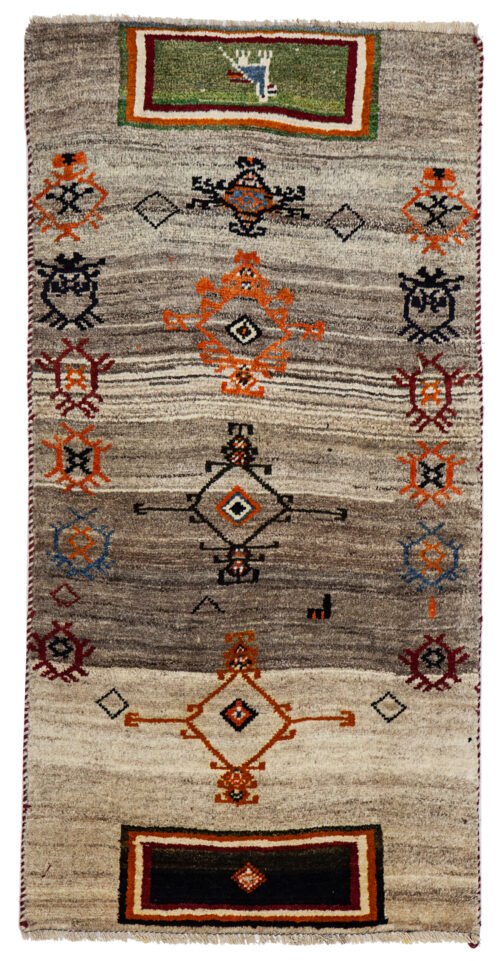 alt="Gabbeh rug with abrushed grey field and quirky tribal motifs" alt="Handwoven Persian Gabbeh from South Iran with imaginative design" alt="Minimalist tribal rug with soft grey tones and symbolic elements" alt="Vintage Gabbeh carpet with natural wool and unique charm"