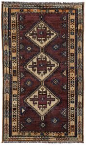 alt="Vintage Lori Behbahan rug with aubergine ground and triple medallion" alt="South Iranian tribal rug with plain field and characterful wear" alt="Decorative Persian rug in rare purple tones and simple layout" alt="Worn but elegant Lori Behbahan carpet with rich colour palette"