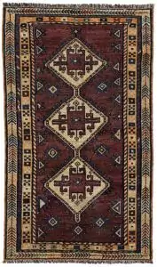 alt="Vintage Lori Behbahan rug with aubergine ground and triple medallion" alt="South Iranian tribal rug with plain field and characterful wear" alt="Decorative Persian rug in rare purple tones and simple layout" alt="Worn but elegant Lori Behbahan carpet with rich colour palette"