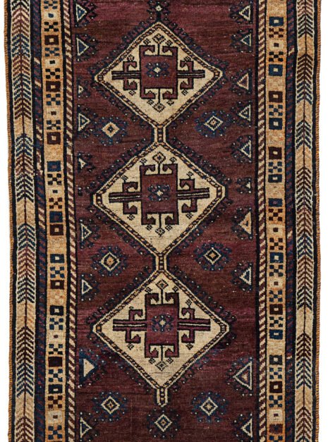 13499-Lori-178x105cm.jpg alt="Vintage Lori Behbahan rug with aubergine ground and triple medallion" alt="South Iranian tribal rug with plain field and characterful wear" alt="Decorative Persian rug in rare purple tones and simple layout" alt="Worn but elegant Lori Behbahan carpet with rich colour palette"