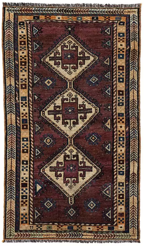 alt="Vintage Lori Behbahan rug with aubergine ground and triple medallion" alt="South Iranian tribal rug with plain field and characterful wear" alt="Decorative Persian rug in rare purple tones and simple layout" alt="Worn but elegant Lori Behbahan carpet with rich colour palette"