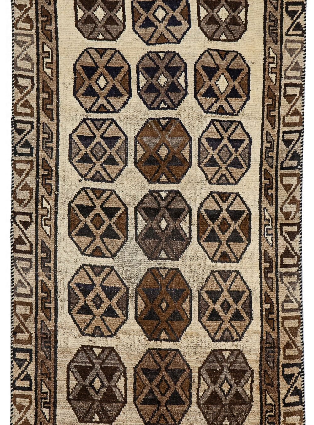alt="Vintage Gabbeh rug with three octagons on aged cream background" alt="Worn tribal Persian rug with simple geometric motifs" alt="Gabbeh rug from South Iran with faded cream field and rustic charm" alt="Low pile antique Gabbeh with mellowed colours and octagon design"
