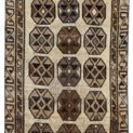 alt="Vintage Gabbeh rug with three octagons on aged cream background" alt="Worn tribal Persian rug with simple geometric motifs" alt="Gabbeh rug from South Iran with faded cream field and rustic charm" alt="Low pile antique Gabbeh with mellowed colours and octagon design"