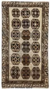 alt="Vintage Gabbeh rug with three octagons on aged cream background" alt="Worn tribal Persian rug with simple geometric motifs" alt="Gabbeh rug from South Iran with faded cream field and rustic charm" alt="Low pile antique Gabbeh with mellowed colours and octagon design"