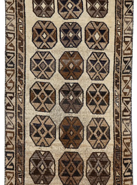 alt="Vintage Gabbeh rug with three octagons on aged cream background" alt="Worn tribal Persian rug with simple geometric motifs" alt="Gabbeh rug from South Iran with faded cream field and rustic charm" alt="Low pile antique Gabbeh with mellowed colours and octagon design"