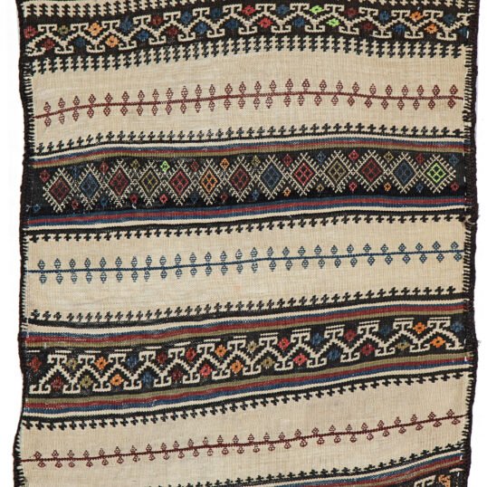 alt="Baluch grain sack with cream base and black and white woven bands" alt="Tribal wool textile from Northeast Iran for decorative use" alt="Finely woven Persian grain sack with geometric motifs" alt="Decorative Baluch textile suitable for draping, hanging, or floor use"