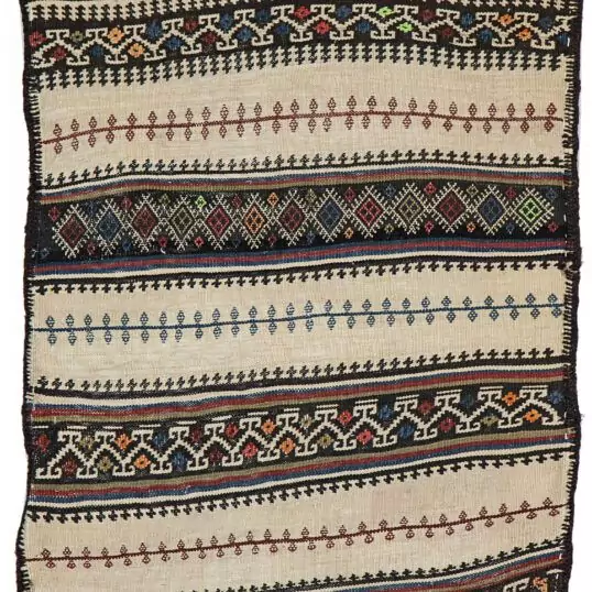 alt="Baluch grain sack with cream base and black and white woven bands" alt="Tribal wool textile from Northeast Iran for decorative use" alt="Finely woven Persian grain sack with geometric motifs" alt="Decorative Baluch textile suitable for draping, hanging, or floor use"