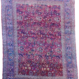 alt="Mashad carpet with maroon red field and floral palmette design" alt="Persian rug from Mashad with blue floral borders and vines" alt="High-quality wool Mashad rug with palmettes and natural dyes" alt="Traditional Persian carpet with red ground and elegant floral detailing"