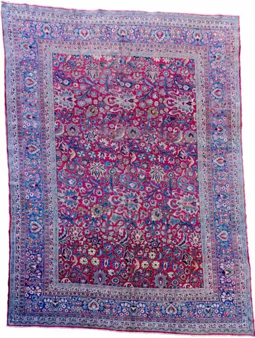 alt="Mashad carpet with maroon red field and floral palmette design" alt="Persian rug from Mashad with blue floral borders and vines" alt="High-quality wool Mashad rug with palmettes and natural dyes" alt="Traditional Persian carpet with red ground and elegant floral detailing"