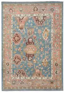 alt="Light blue Ushak carpet with random stylised floral motifs" alt="Decorative Turkish rug with peach border and cream guard accents" alt="Ushak carpet with geometric floral design and natural dye wool" alt="Modern Ushak rug with antique aesthetic and soft blue ground"