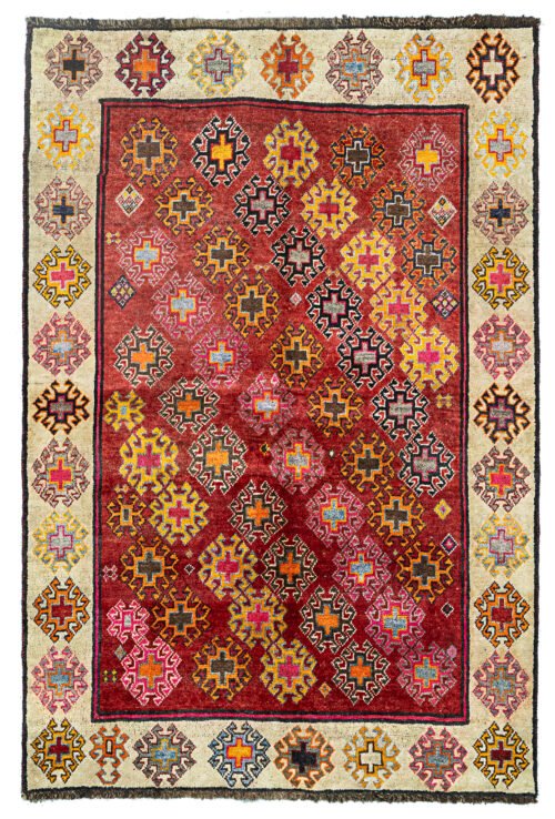 alt="Gabbeh rug with rich red ground and cream border from South Iran" alt="Simple tribal Persian rug with all-over design and natural wool" alt="Handwoven Gabbeh with red field and decorative cream frame" alt="South Iranian tribal rug with warm color palette and handmade charm"