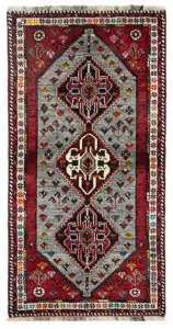 alt="Grey-ground Qashqai rug with scarab beetle medallions and red border" alt="Tribal Persian rug with cream central medallion and abrushed field" alt="Handwoven Qashqai wool rug with symbolic motifs and natural dyes" alt="Rare Qashqai carpet with scarab design and elegant colour contrast"