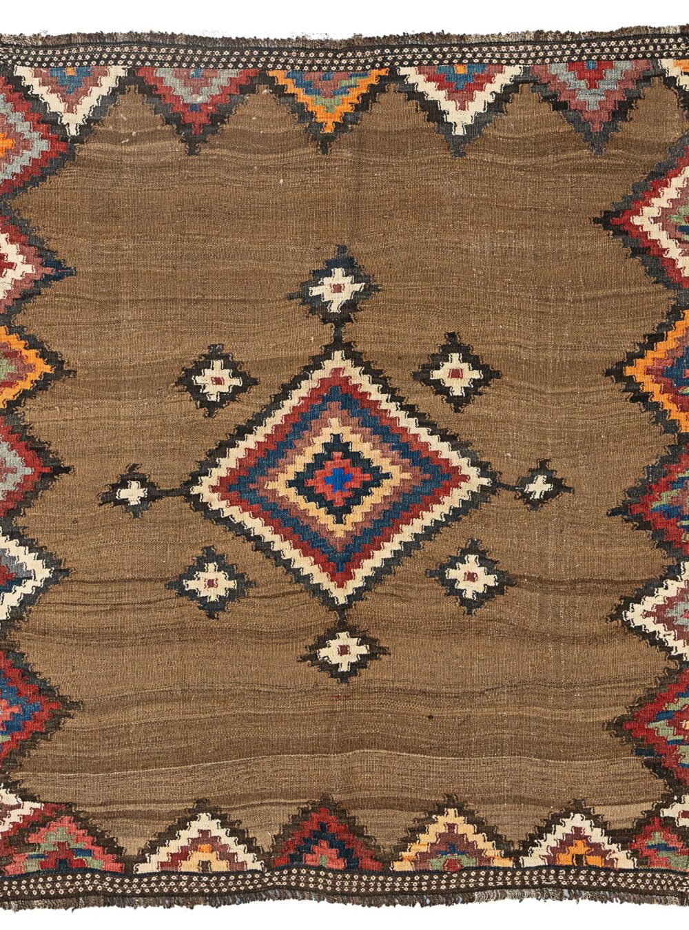 alt="Antique Varamin kilim with camel ground and multicoloured medallion" alt="Persian tribal kilim with handspun wool and natural dyes" alt="Varamin kilim featuring wave-like abrushes and floral end designs" alt="Collector-quality Varamin kilim with geometric medallion and camel field"