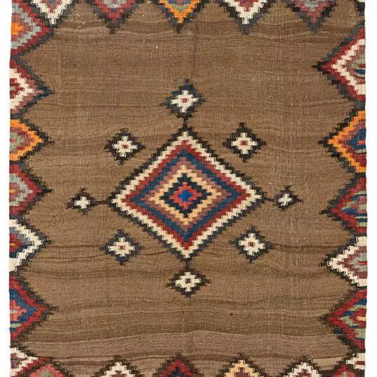 alt="Antique Varamin kilim with camel ground and multicoloured medallion" alt="Persian tribal kilim with handspun wool and natural dyes" alt="Varamin kilim featuring wave-like abrushes and floral end designs" alt="Collector-quality Varamin kilim with geometric medallion and camel field"