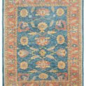 alt="Ushak carpet with blue background and large floral vine design" alt="New antique-look Turkish rug with terracotta floral border" alt="Handspun wool Ushak rug with authentic weave and natural dyes" alt="Decorative blue and terracotta Ushak carpet with aged finish