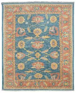 alt="Ushak carpet with blue background and large floral vine design" alt="New antique-look Turkish rug with terracotta floral border" alt="Handspun wool Ushak rug with authentic weave and natural dyes" alt="Decorative blue and terracotta Ushak carpet with aged finish