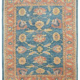 alt="Ushak carpet with blue background and large floral vine design" alt="New antique-look Turkish rug with terracotta floral border" alt="Handspun wool Ushak rug with authentic weave and natural dyes" alt="Decorative blue and terracotta Ushak carpet with aged finish
