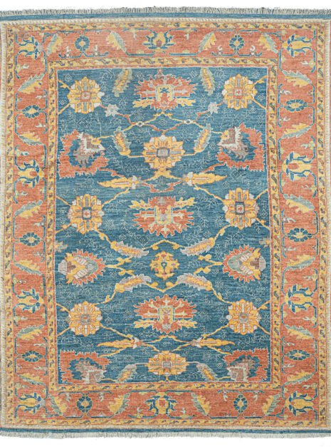 alt="Ushak carpet with blue background and large floral vine design" alt="New antique-look Turkish rug with terracotta floral border" alt="Handspun wool Ushak rug with authentic weave and natural dyes" alt="Decorative blue and terracotta Ushak carpet with aged finish