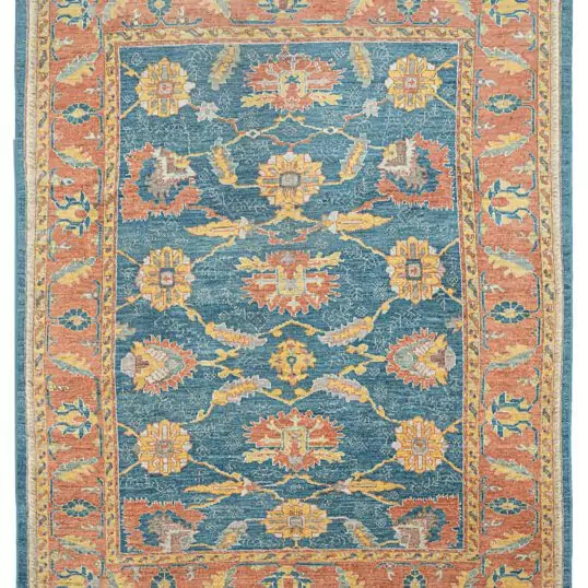 alt="Ushak carpet with blue background and large floral vine design" alt="New antique-look Turkish rug with terracotta floral border" alt="Handspun wool Ushak rug with authentic weave and natural dyes" alt="Decorative blue and terracotta Ushak carpet with aged finish