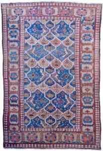 alt="Bakhshayesh carpet with blue field and all-over bush design" alt="Persian rug with lozenge bands and geometric light brown border" alt="Rare Bakhshayesh carpet with tribal bush motifs and decorative colors" alt="Traditional Persian rug from Northwest Iran with unique all-over pattern"